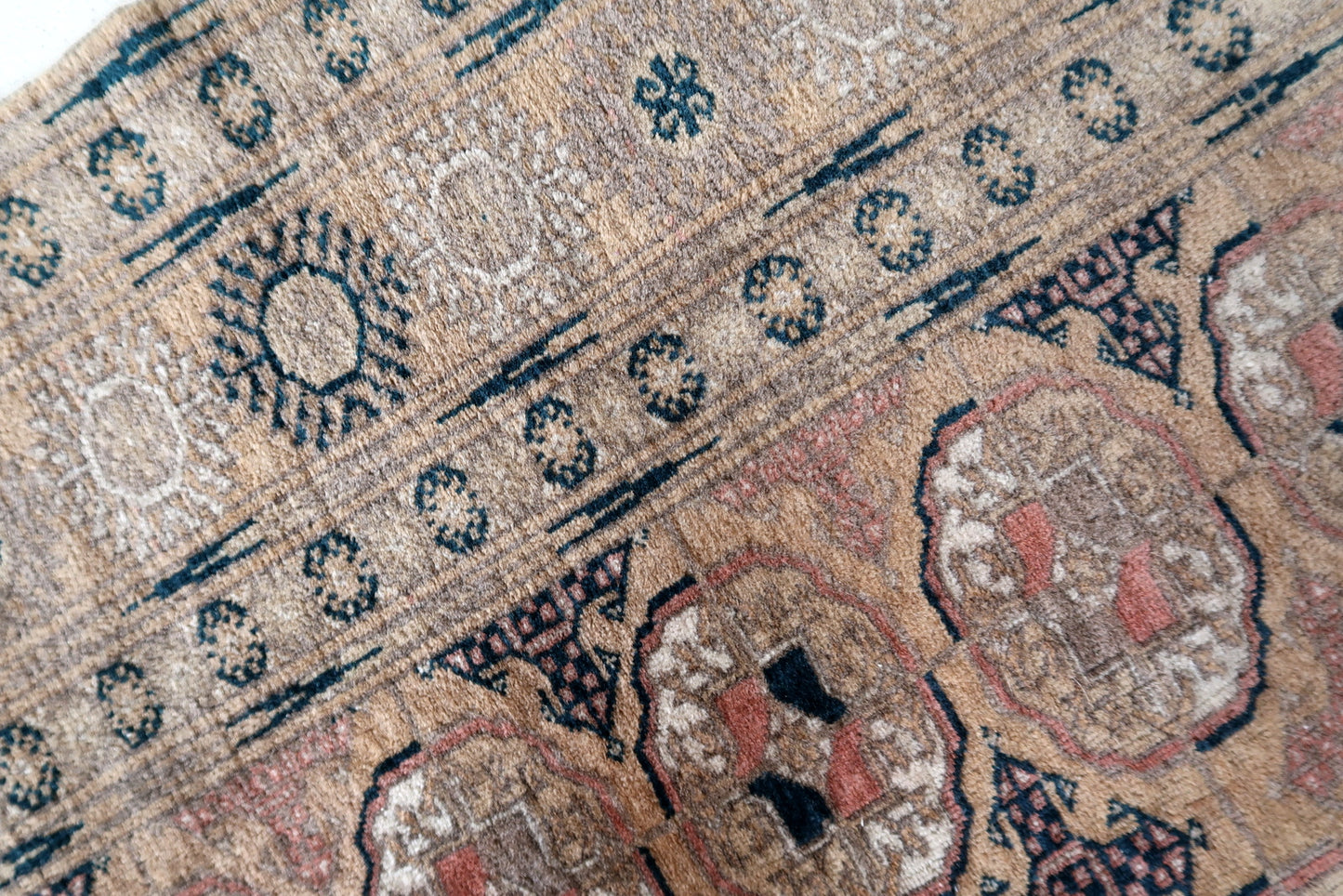 Authentic handmade Afghan rug with detailed border design