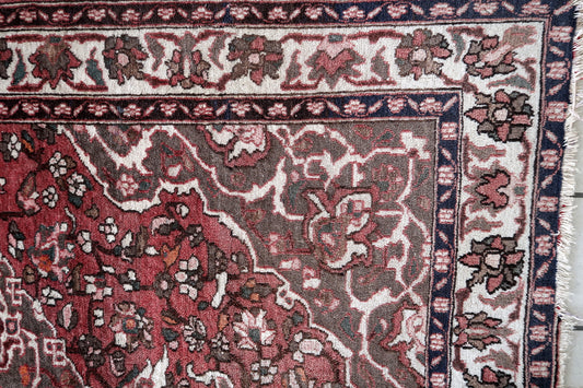 1960s Persian wool rug with floral motifs