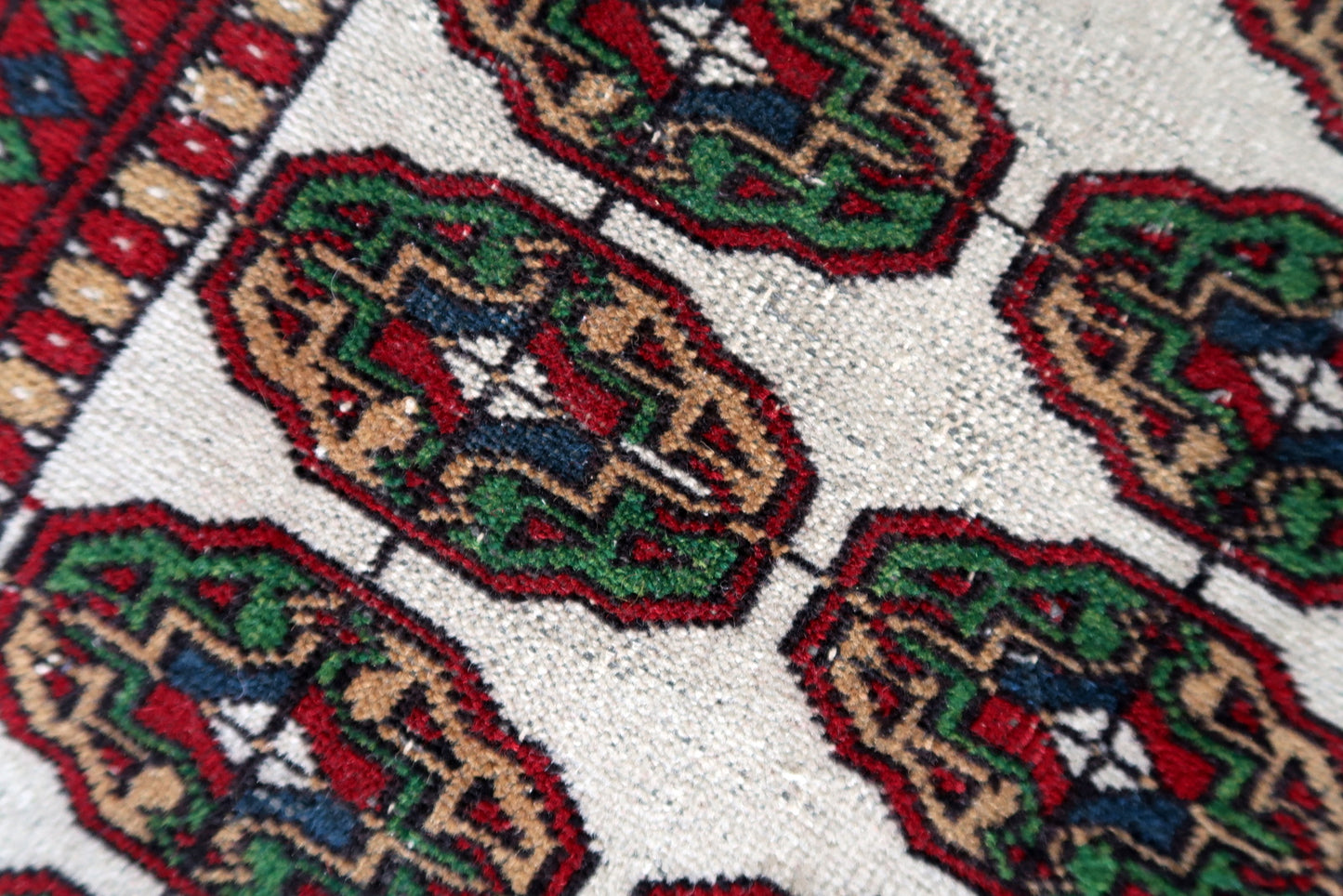 Uzbek rug with geometric and floral borders