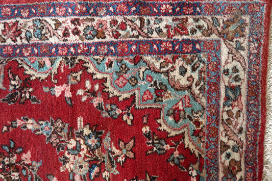 1950s handmade Persian rug in navy and rust