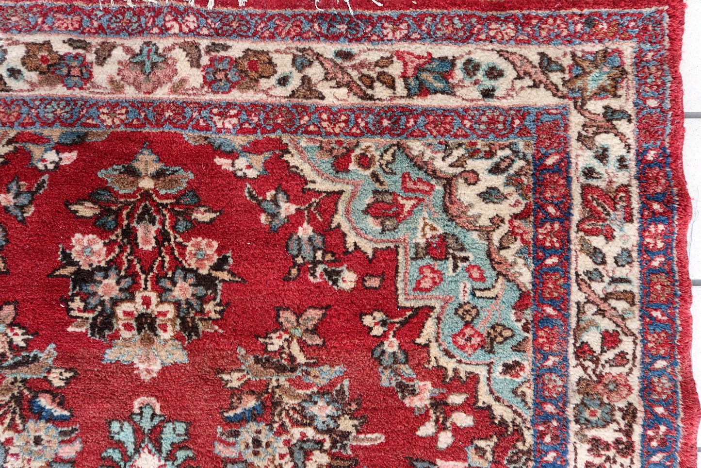 Hand-knotted Persian rug with tribal motifs