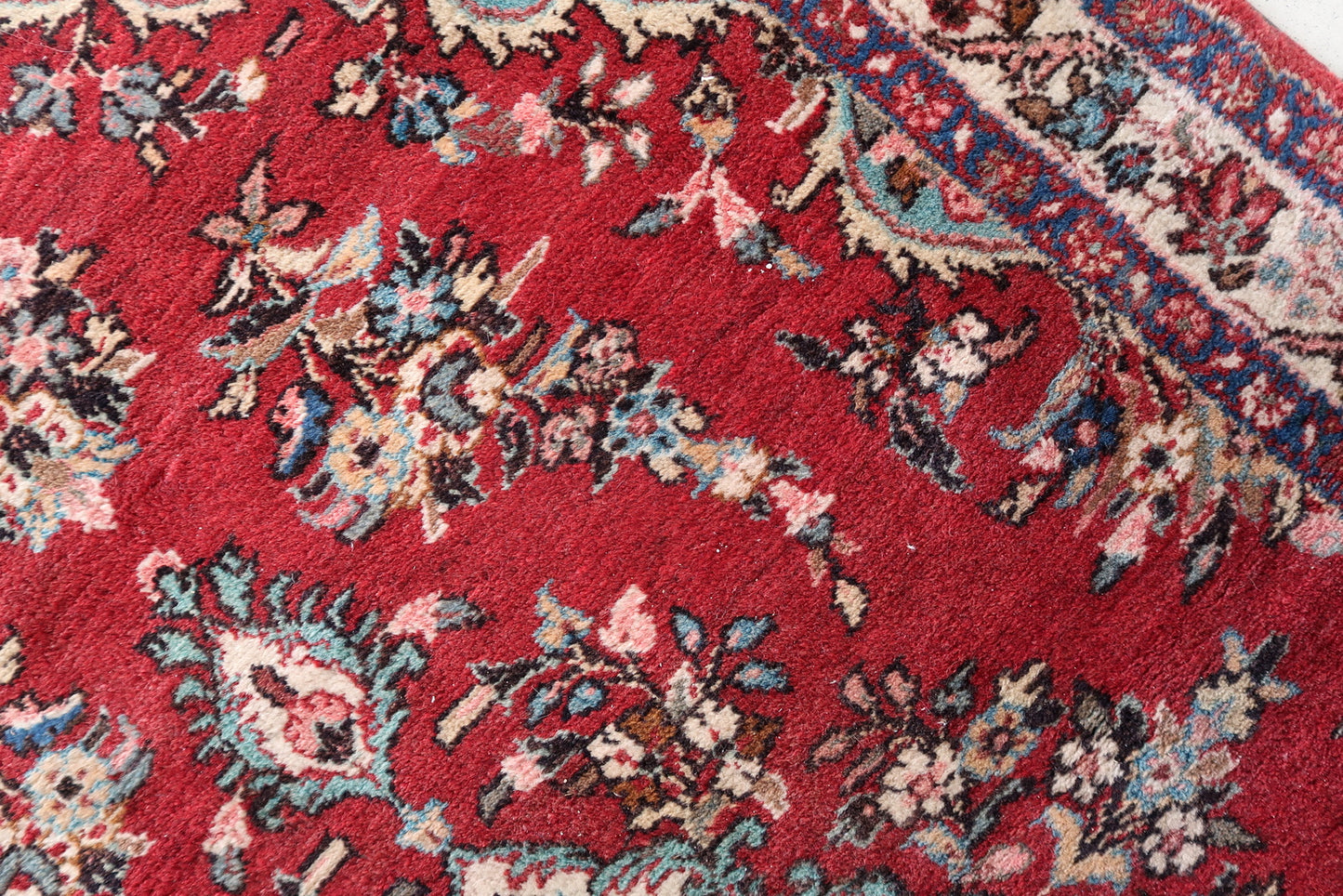 Close-up of Malayer rug floral motif