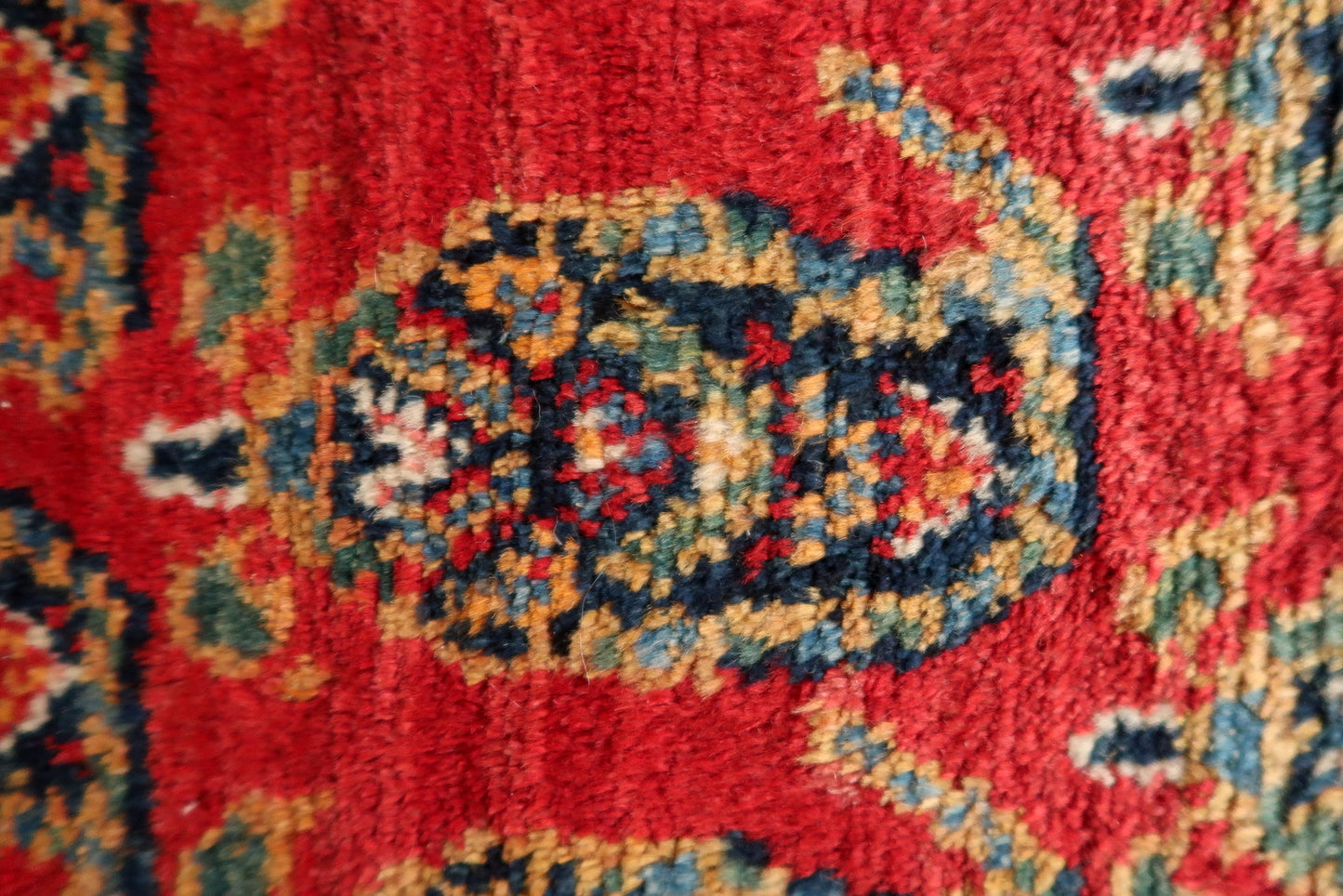 Overall pattern repeat across the entire surface of the vintage carpet.