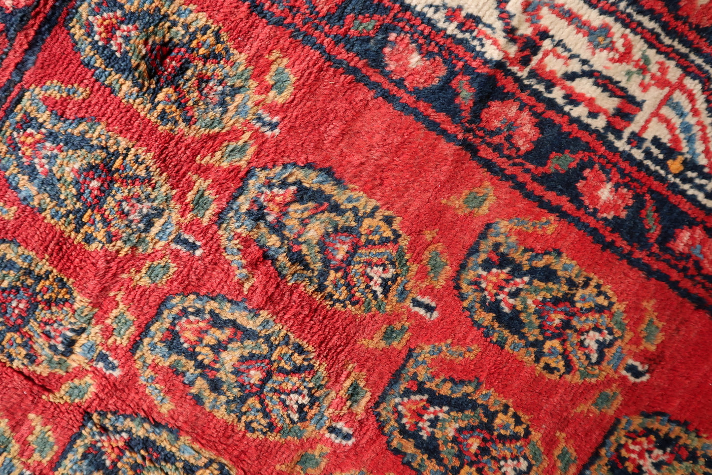Flat lay highlighting the vibrant contrast between the red field and navy blue motifs.