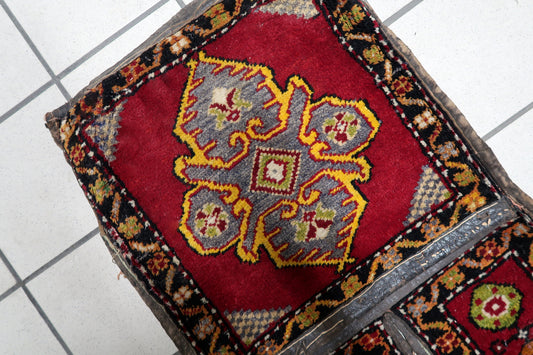 Geometric tribal medallions on rich red background