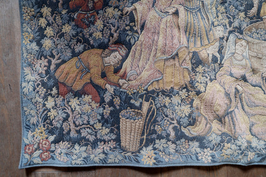 Medieval wine harvest scene with grape treading figures