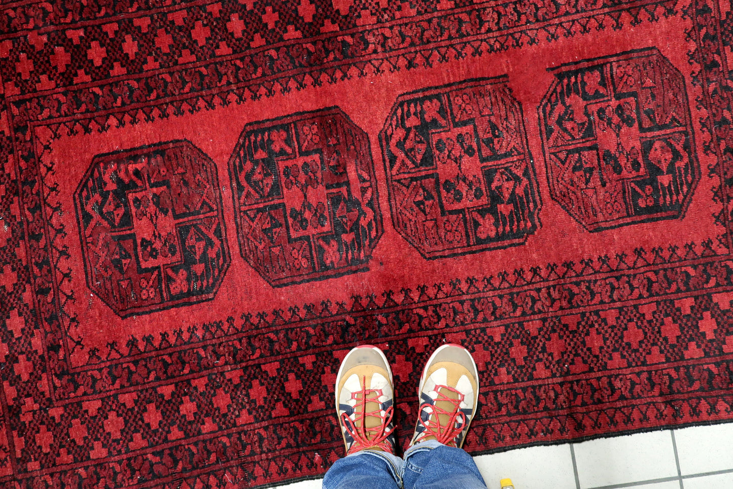 1920s handmade Afghan tribal rug suitable as a bold architectural statement for traditional library