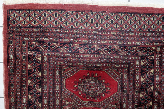 Bukhara carpet Tekke-influenced geometric borders ivory black accents