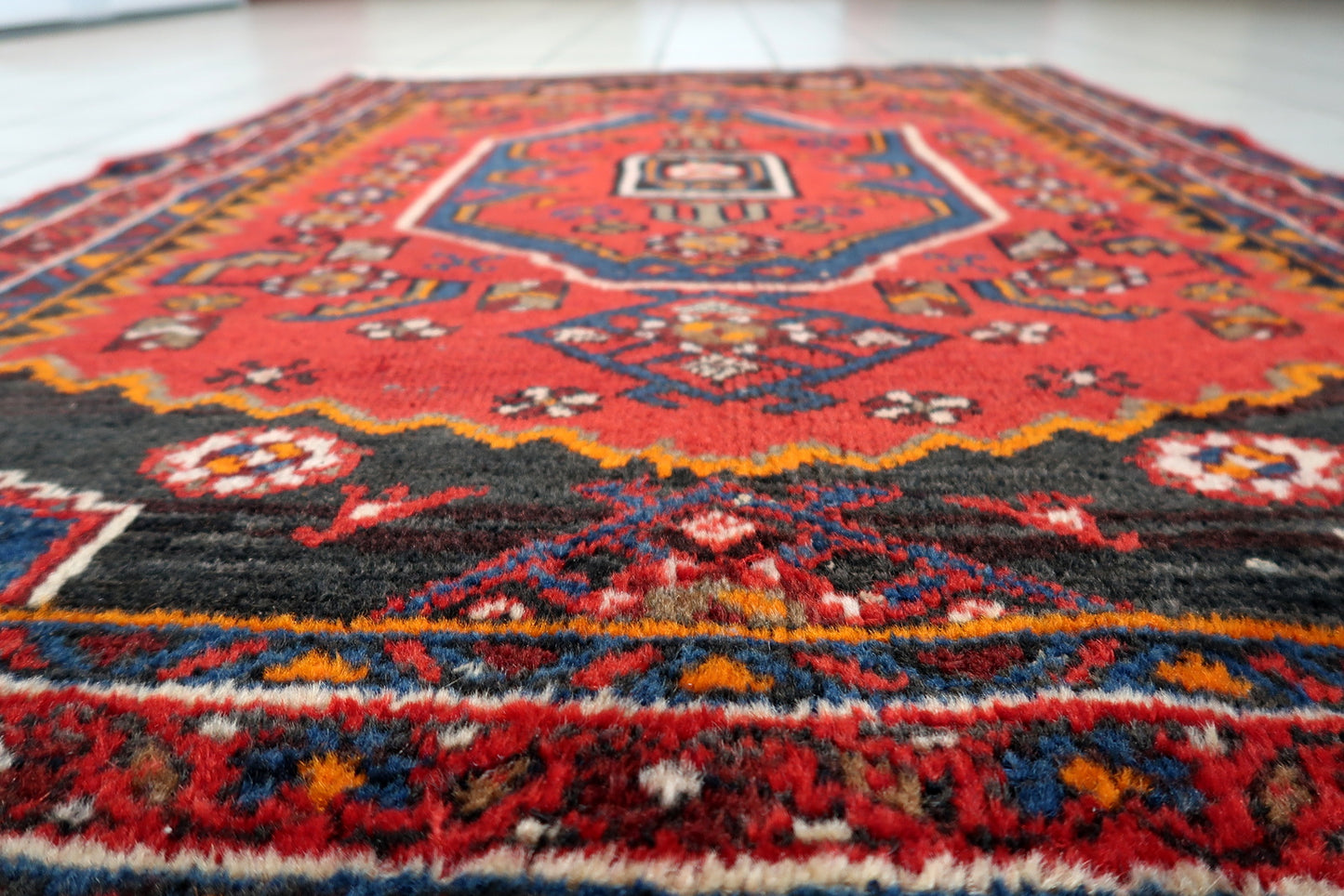 Hand-knotted 1930s Hamadan carpet, vibrant red with geometric medallion.