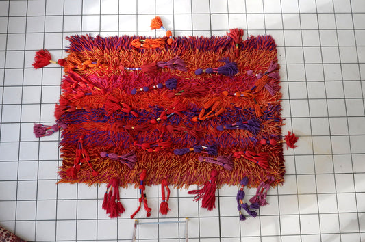 Handmade Scandinavian Rya carpet featuring bold abstract sunset-inspired design