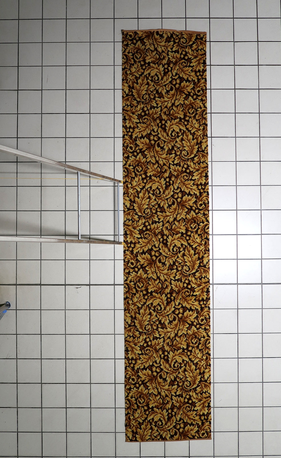 German-made acrylic hallway carpet displaying a refined leaf-inspired pattern in warm neutral shades