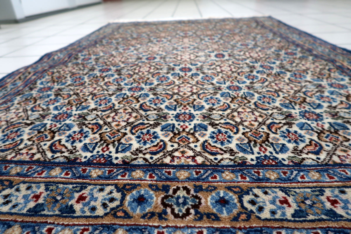 Fine hand-knotted wool pile showcasing natural directional sheen, fiber luster, and soft textured surface.
