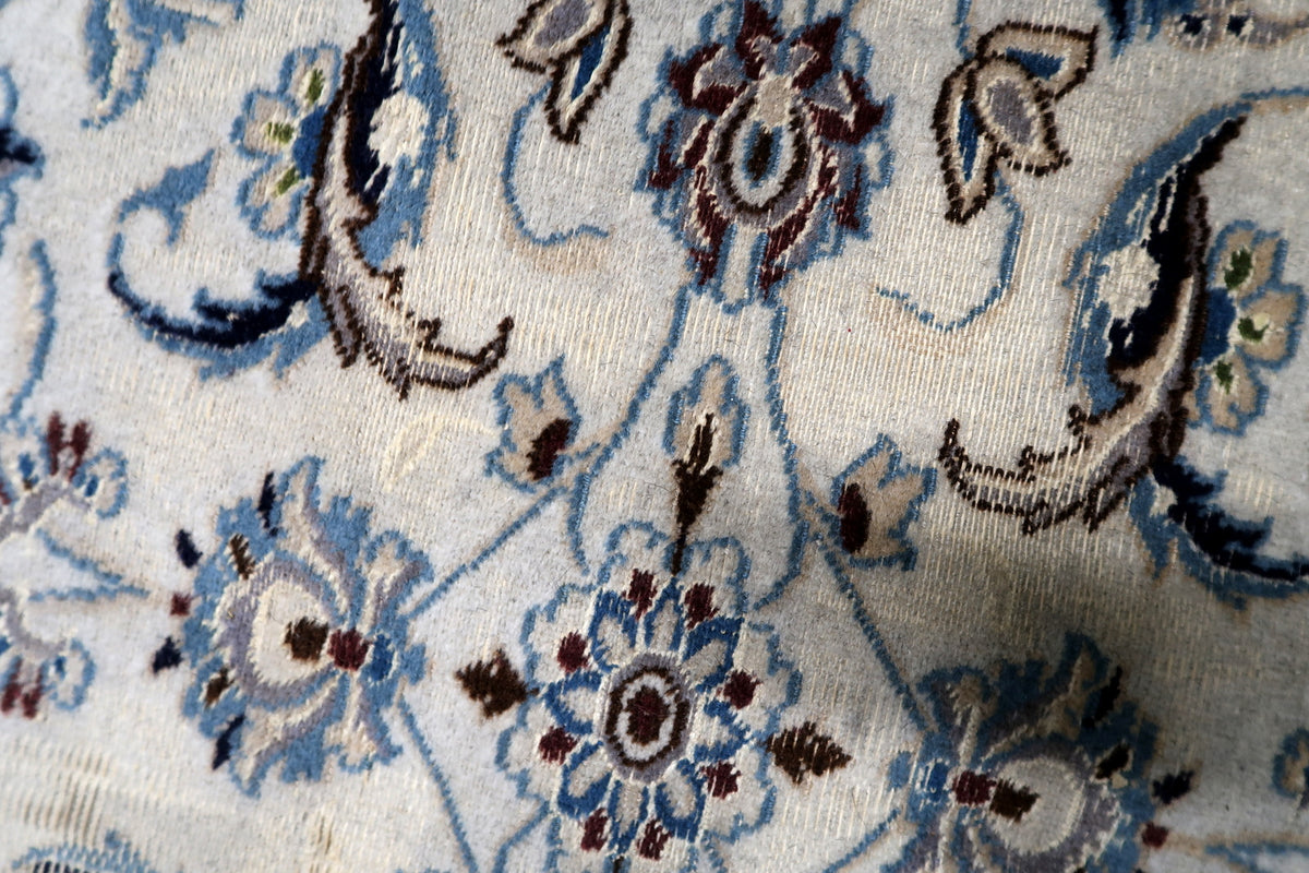 Symmetrical floral pattern design framed by traditional botanical elements and decorative silk-accented scrollwork.