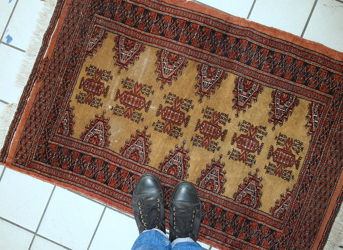 Full view of the handmade vintage Bukhara rug with a soft wool texture.
