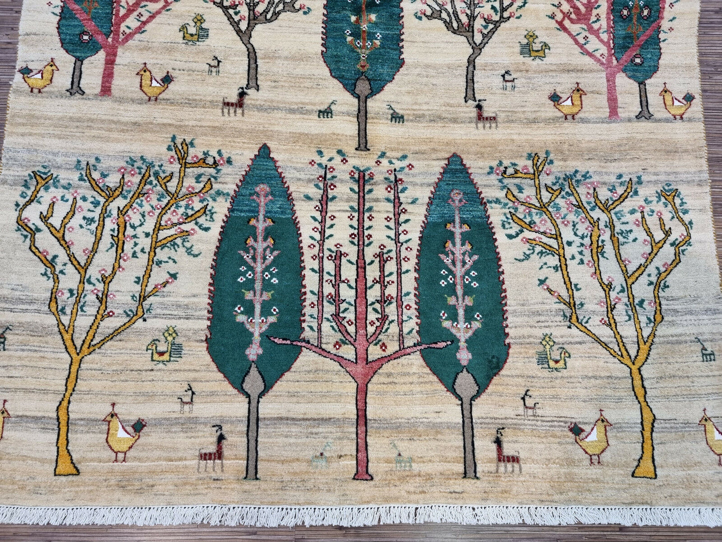 Artistic arrangement of birds and trees on the Persian Gabbeh rug