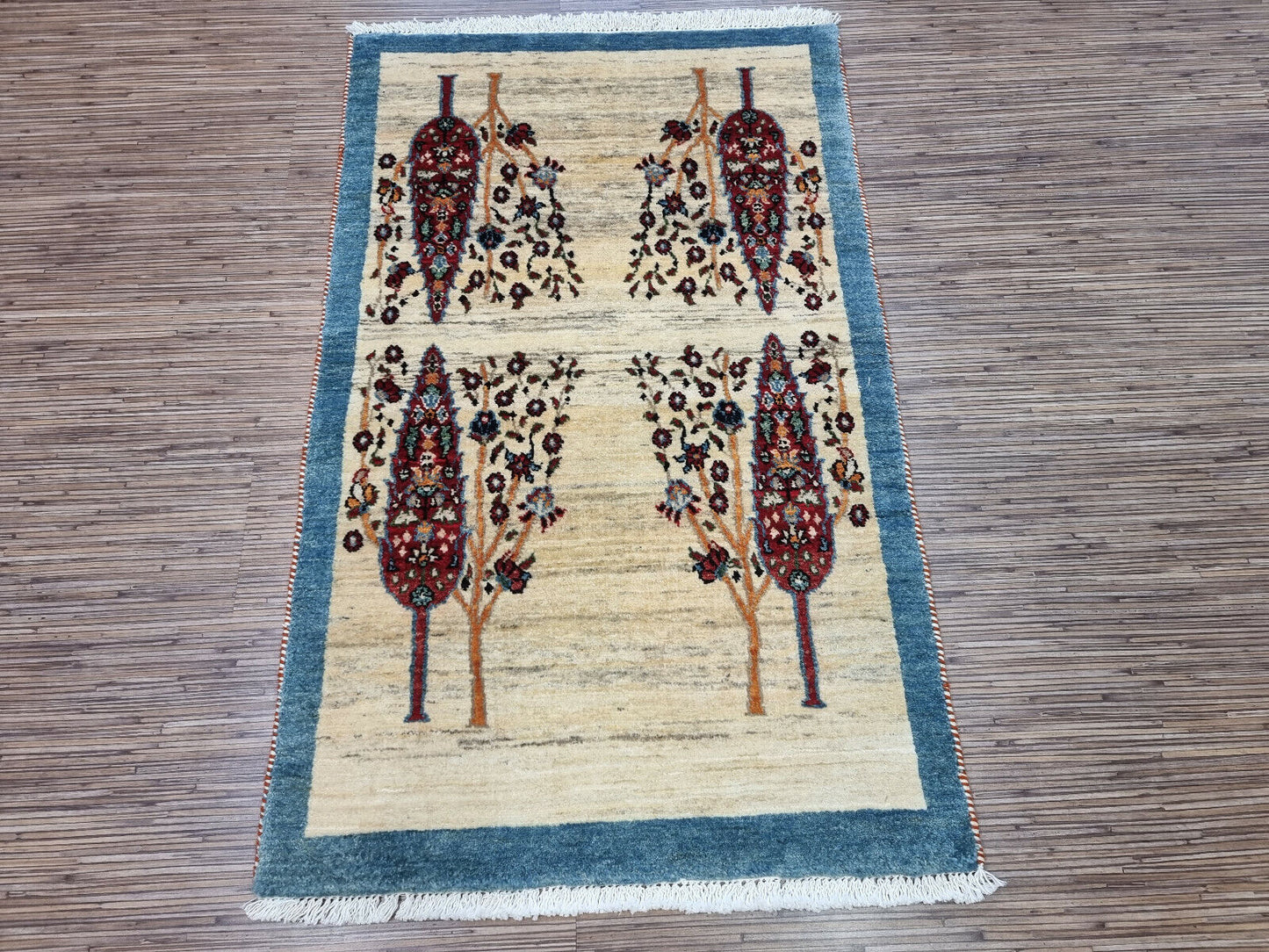 Tree design detail on handmade Persian Gabbeh carpet