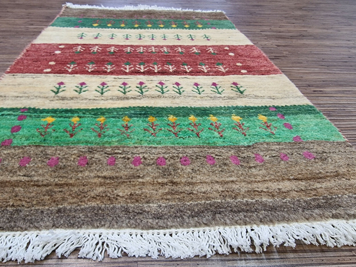 Border detail of beige Persian Gabbeh rug