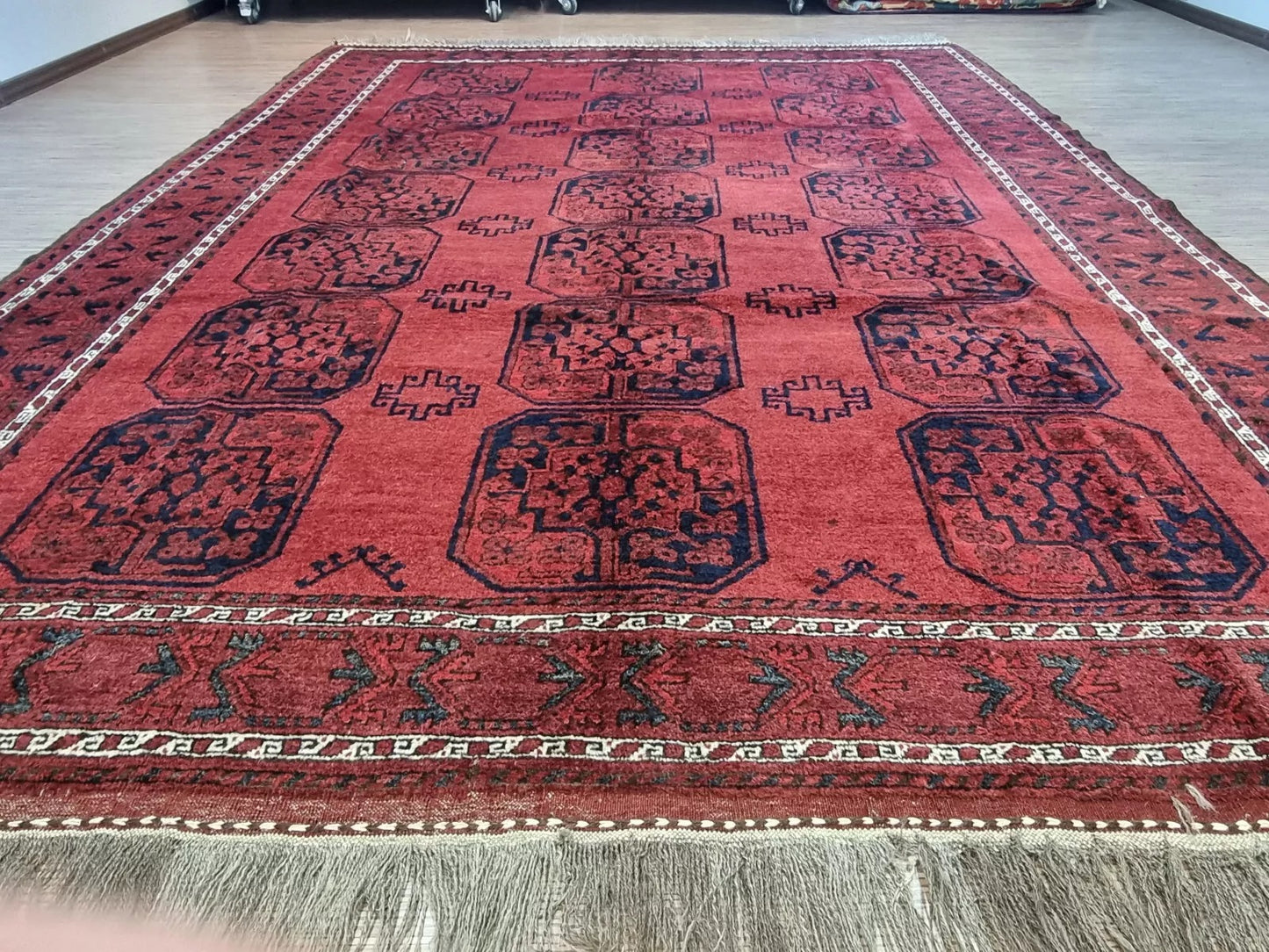 Intricate Afghan Ersari motifs on a hand-knotted rug