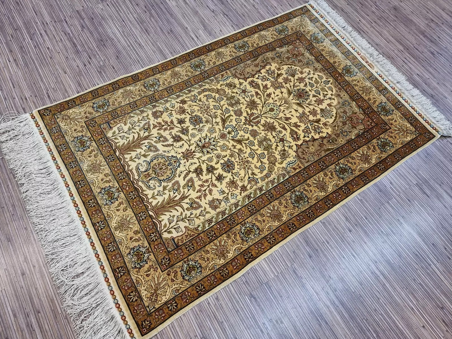 Soft silk Hereke rug with vibrant colors and Oriental motifs