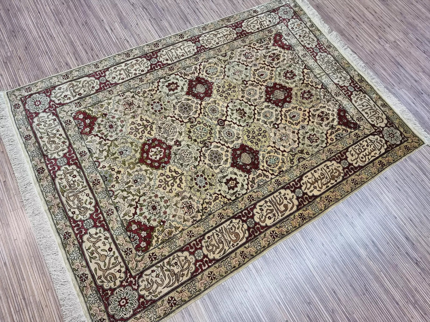Soft, shimmering silk texture of the Turkish Hereke rug under light
