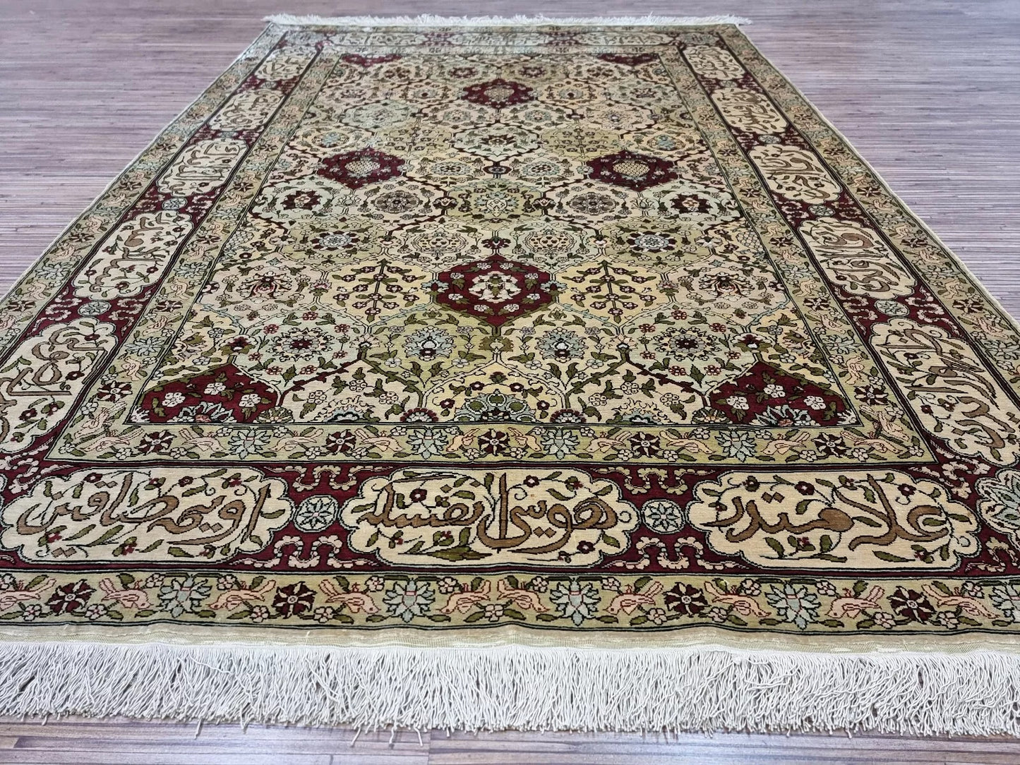 Handwoven knots and detailed patterns on the vintage Hereke silk masterpiece