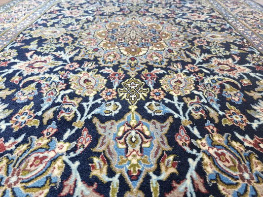 Close-up of hand-knotted kork wool on silk foundation in a 1970s Persian rug