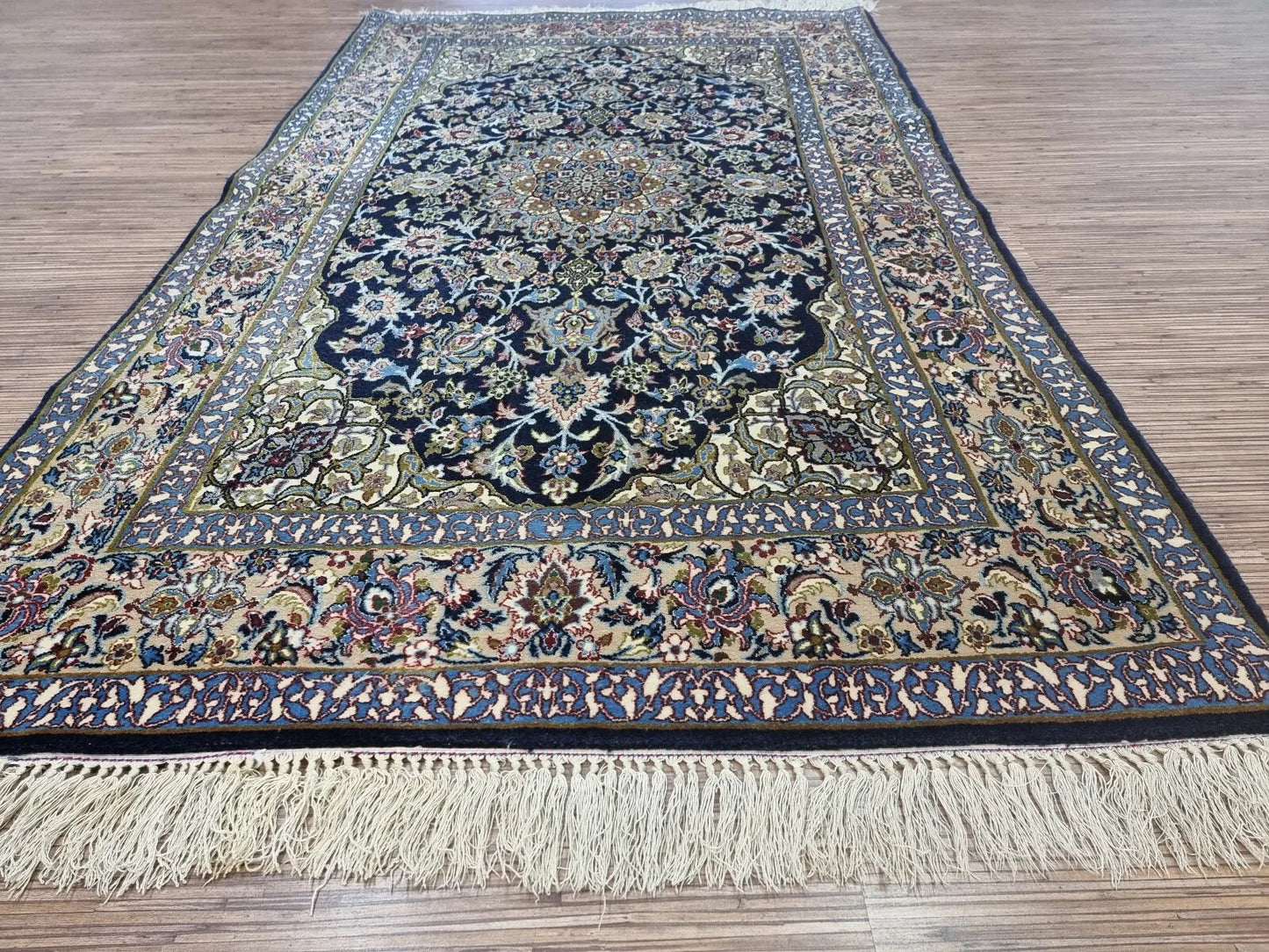 A close-up of the silk foundation, giving the rug a delicate sheen