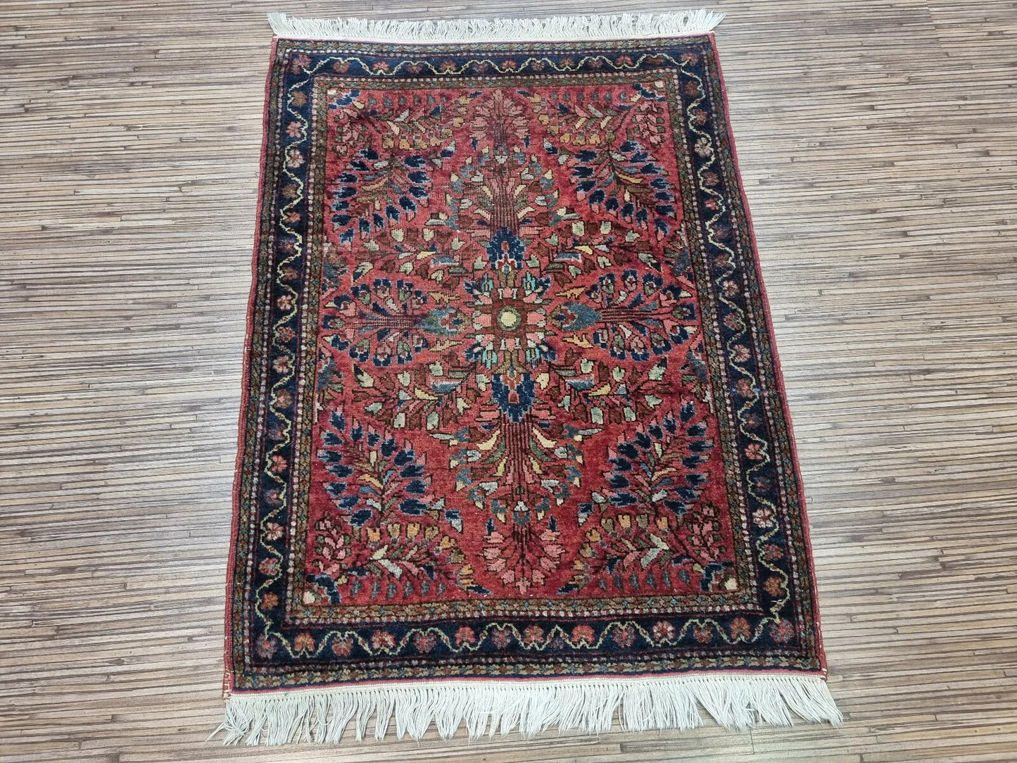 The rug styled in a cozy reading nook for a warm, antique aesthetic