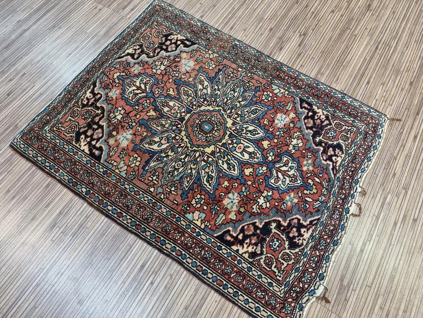 Detailed view of the border design on a handmade Farahan rug from the 1880s