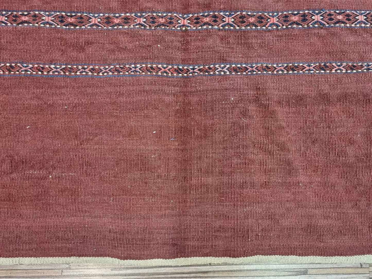 Side view of a rare collectible Turkmen Sumak textile bag