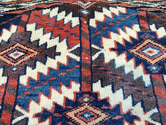 Close-up of geometric motifs in traditional red color palette