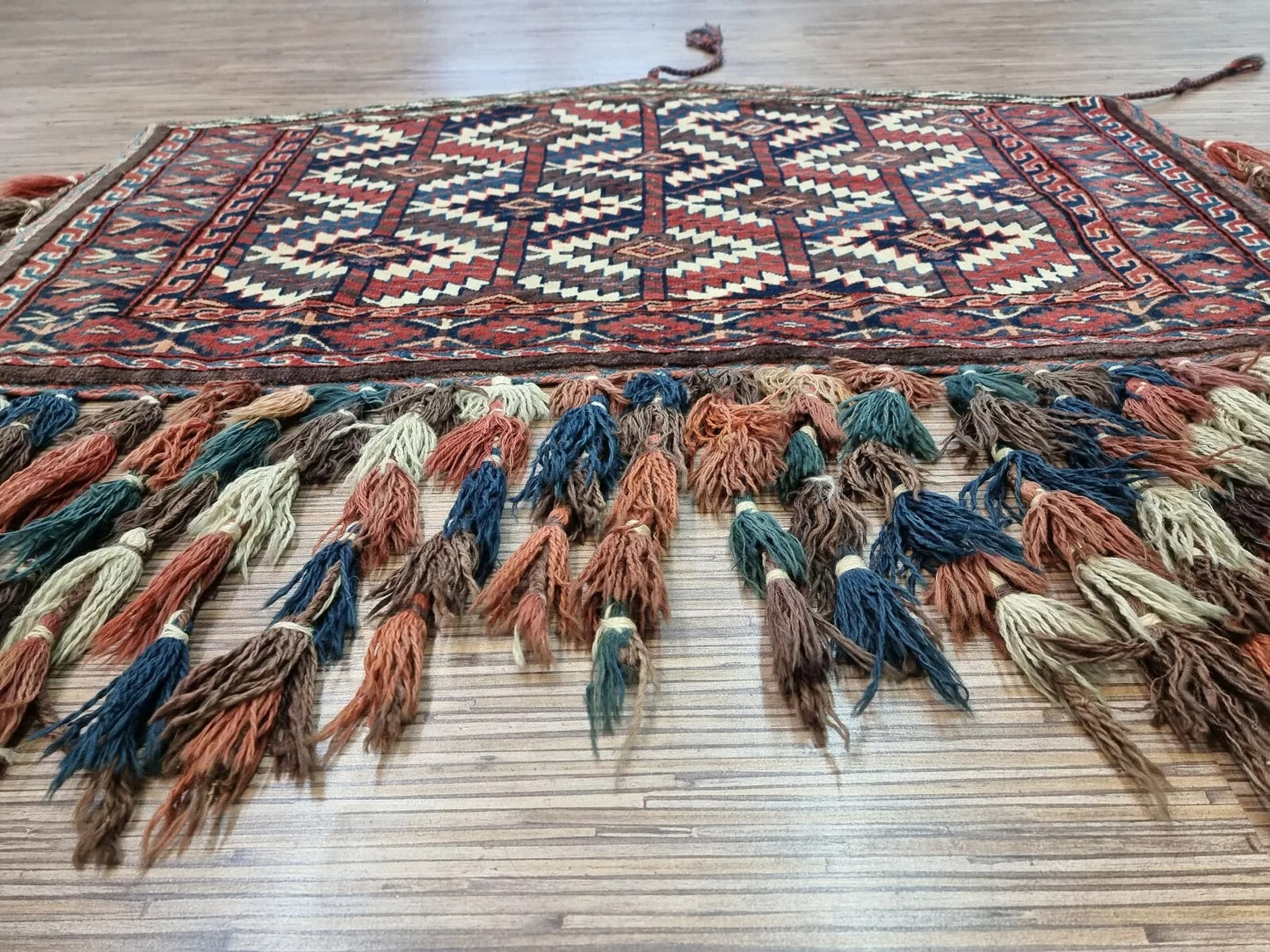 Vibrant red and intricate pattern preserved over 140 years