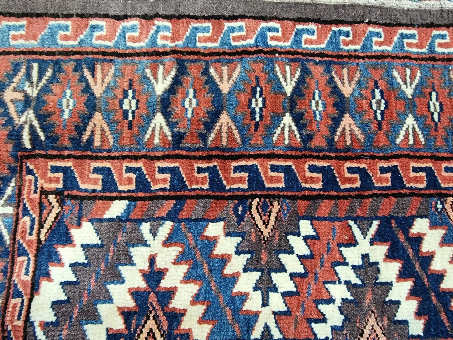 Backside of the rug highlighting hand-knotted craftsmanship