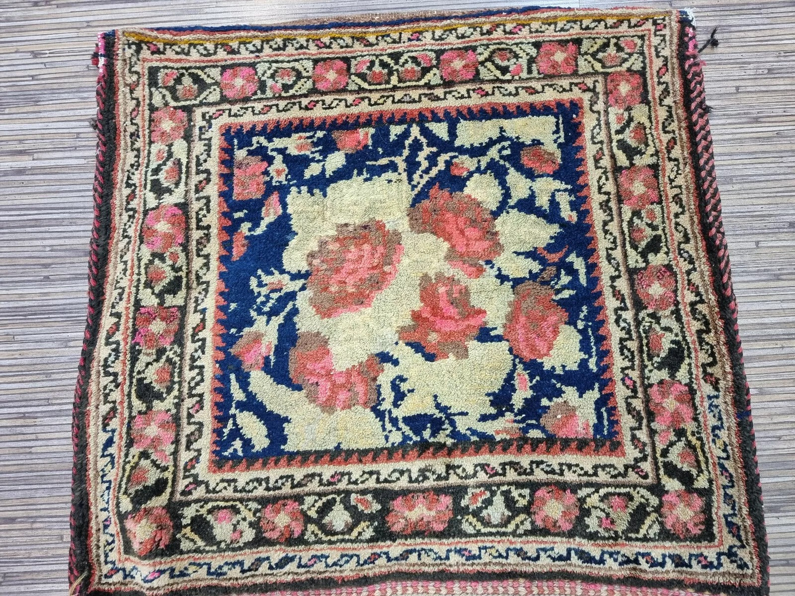 Antique Afshar saddle bag displayed in a living room setting