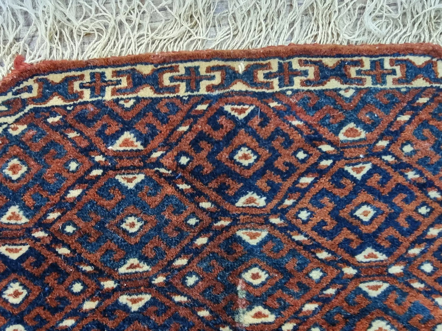 1880s Turkmen Yomud rug showcasing symmetrical designs