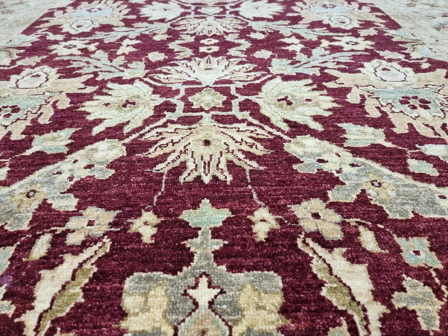 Medium pile floral rug in vintage condition