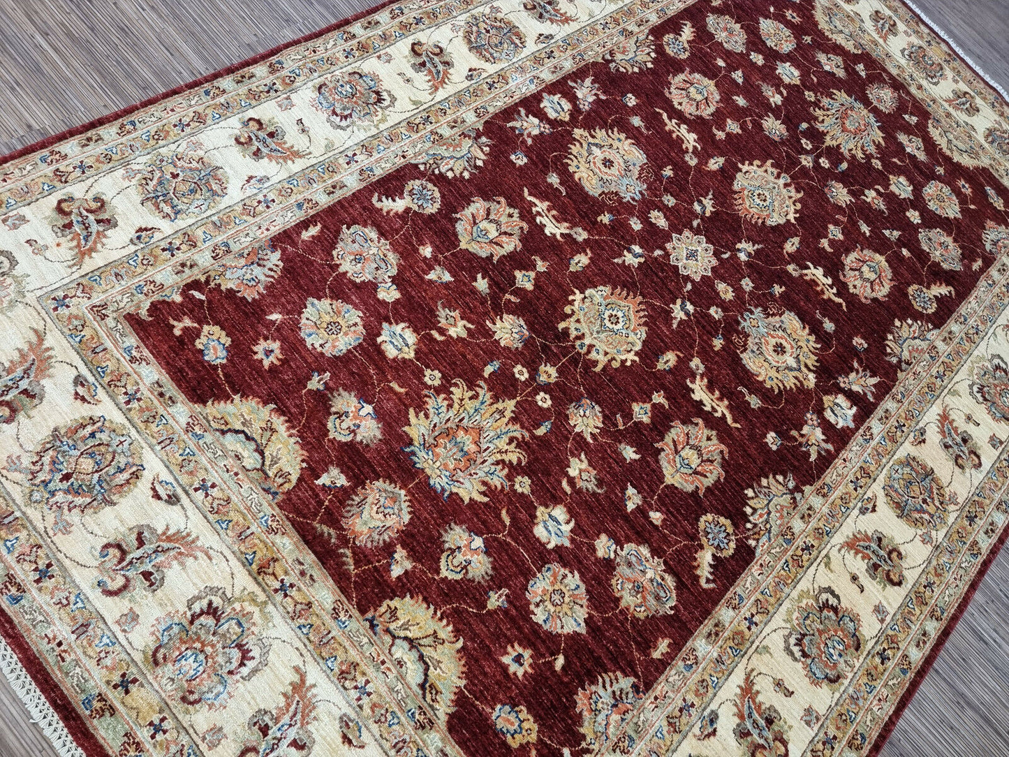 Corner detail of Afghan Zigler rug with scrolling vines