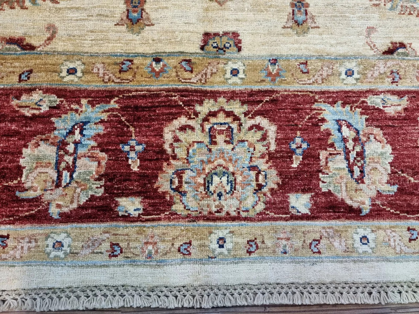 Close-up of Afghan floral pattern rug