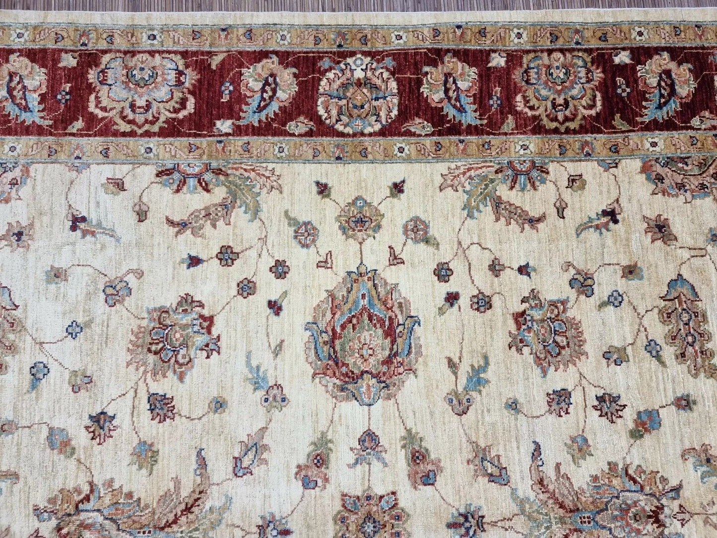 Afghan rug with elegant border detail