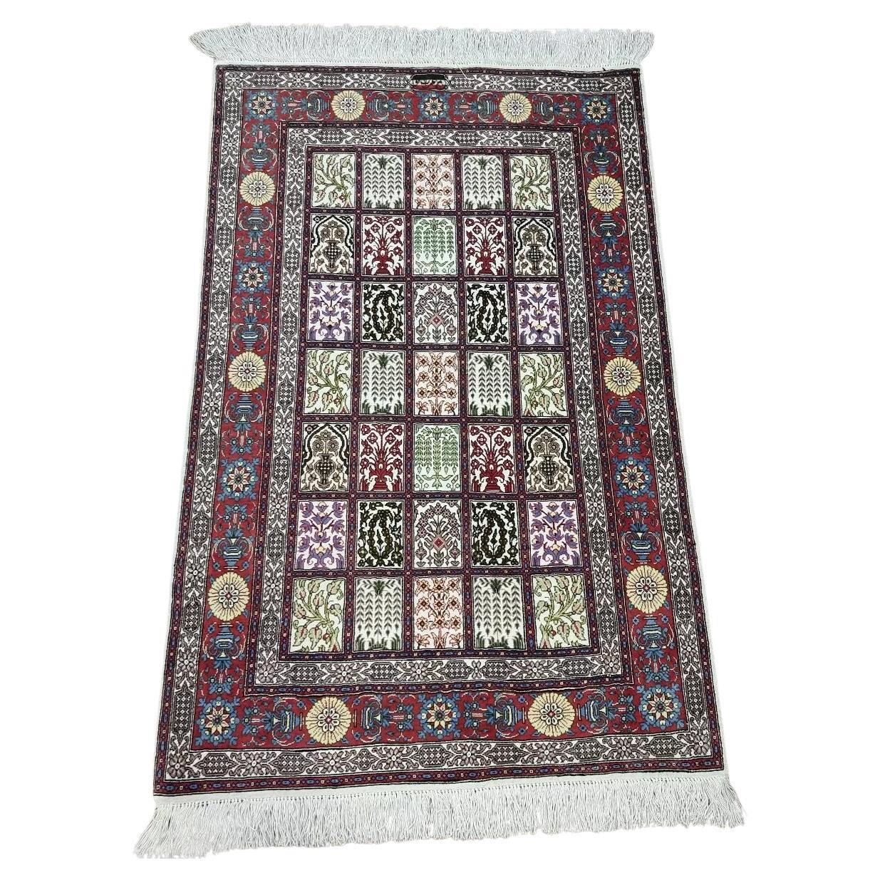 Vintage Persian Qum silk rug with floral medallion