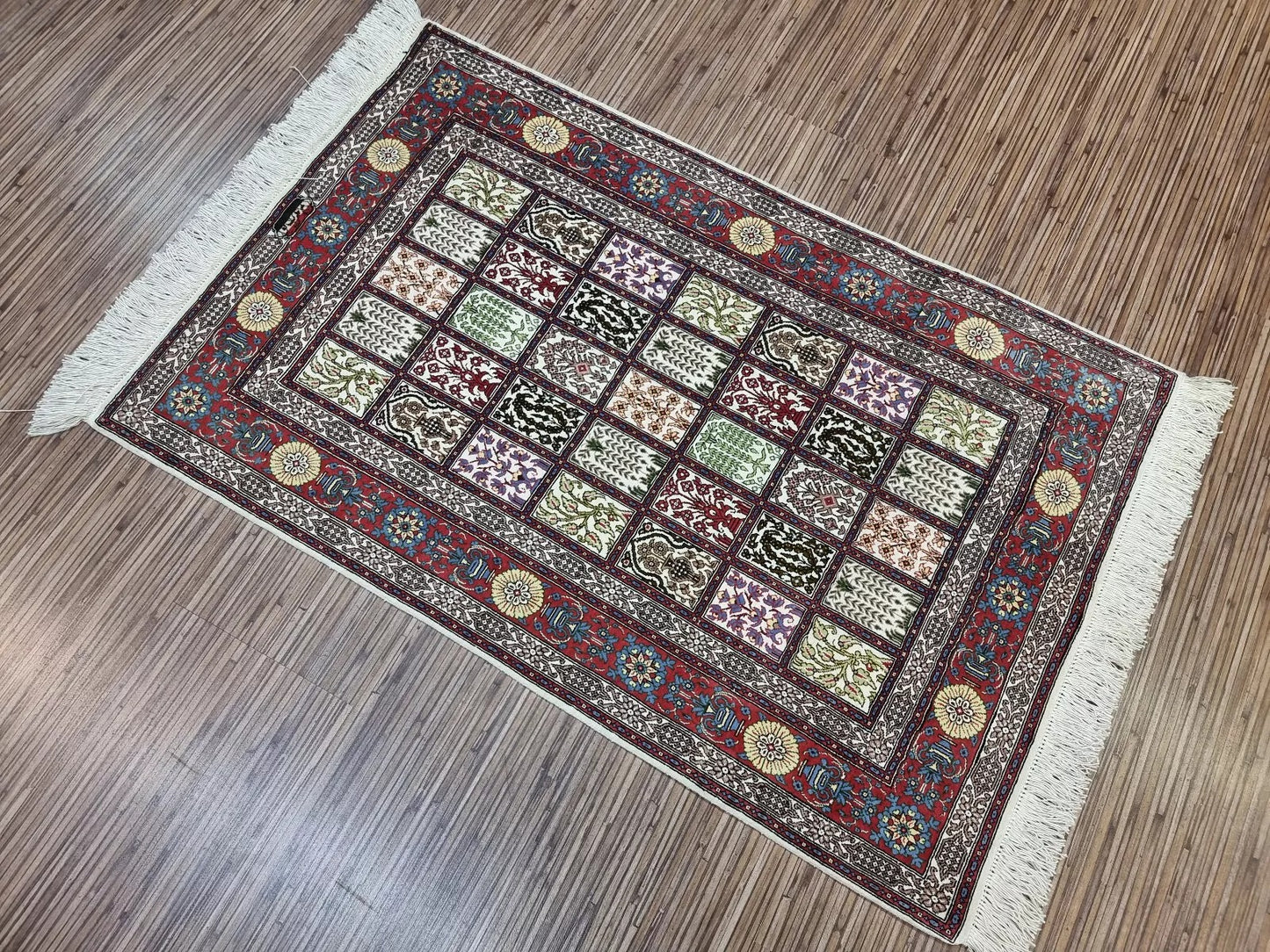 Classic Persian Qum rug with rich details