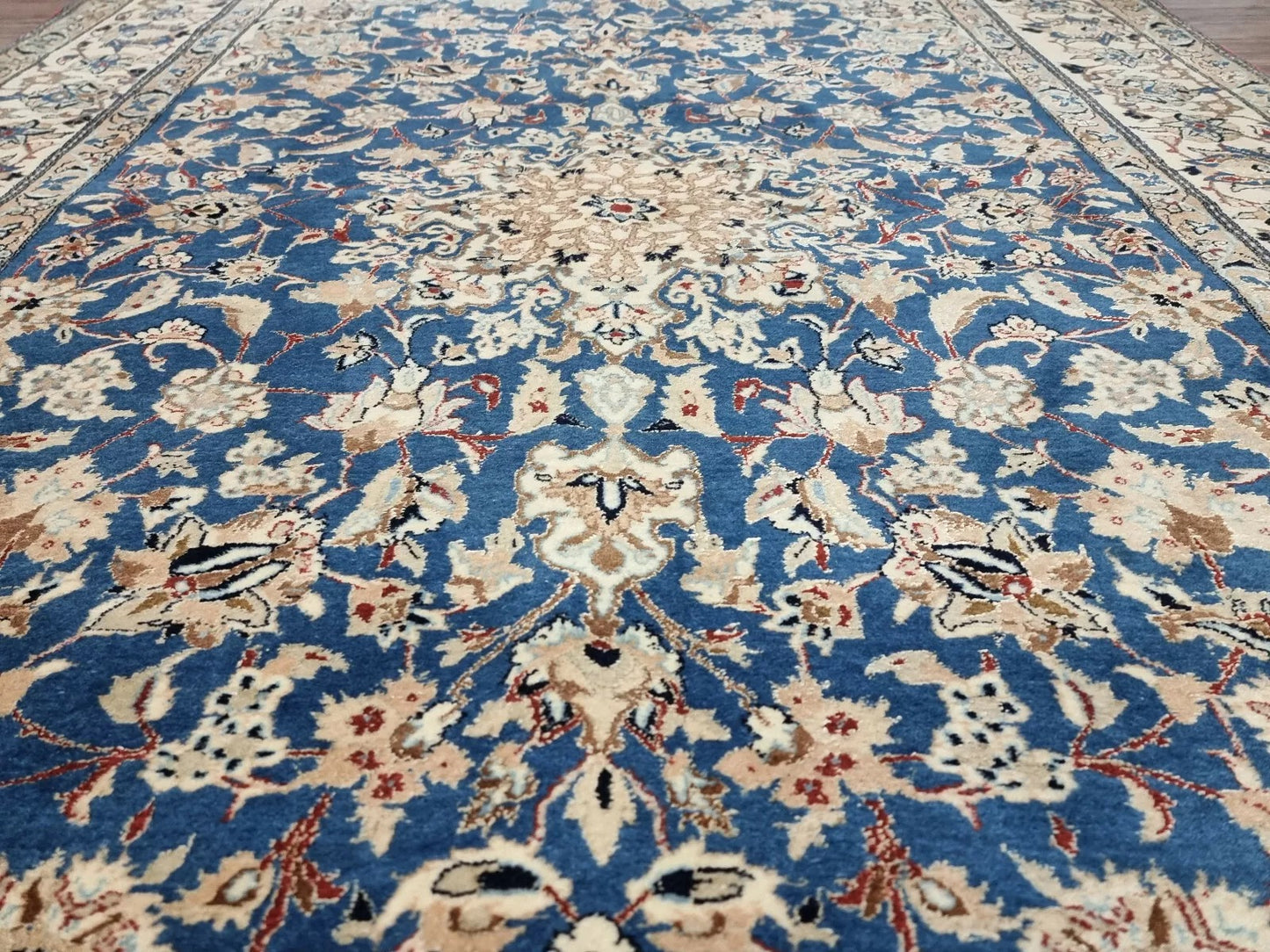 Small vintage Persian Nain rug in excellent condition for its age, with a soft beige palette, intricate floral medallions, and a durable high-density weave suitable for accent spaces.
