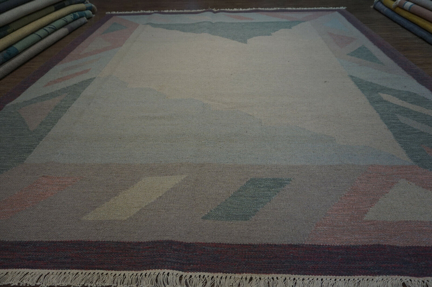Add a touch of history to your home with this Pastel Geometric Handwoven Indian Dhurrie Rug.