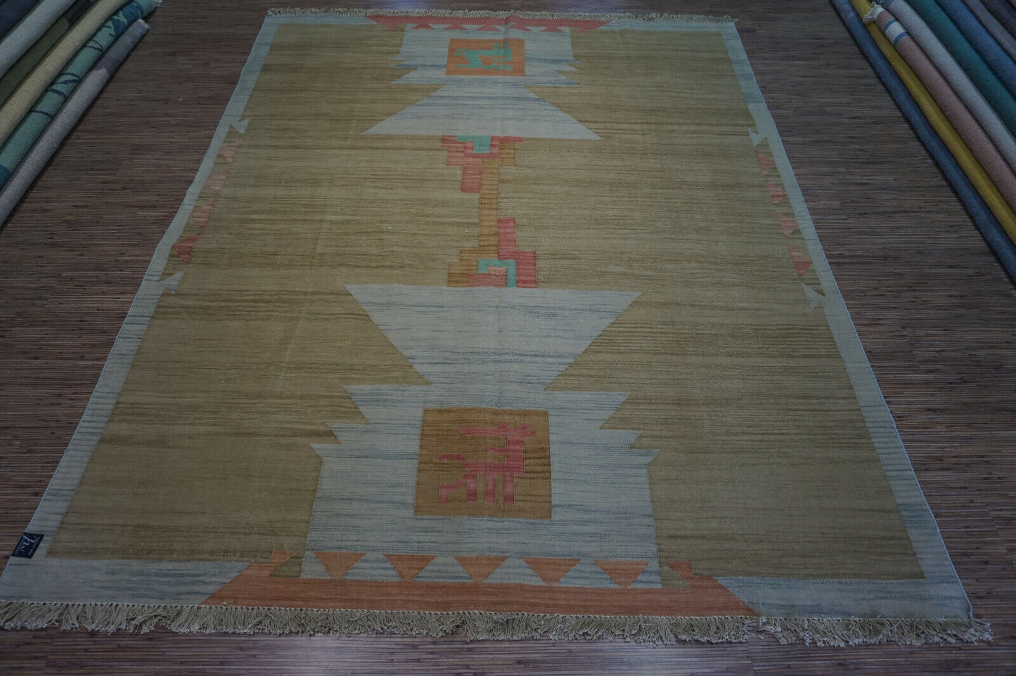 Embrace vintage style: Handwoven Indian Kilim Rug in earthy tones and soft pink accents (6.5' x 8.2').
