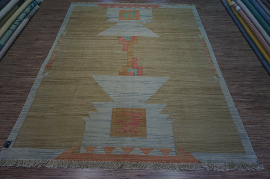 Embrace vintage style: Handwoven Indian Kilim Rug in earthy tones and soft pink accents (6.5' x 8.2').