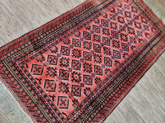 Vintage Afghan Rug: A Timeless Treasure: Embrace the timeless elegance of this handwoven Afghan rug, dating back to the 1960s, and add a touch of cultural heritage to your home.