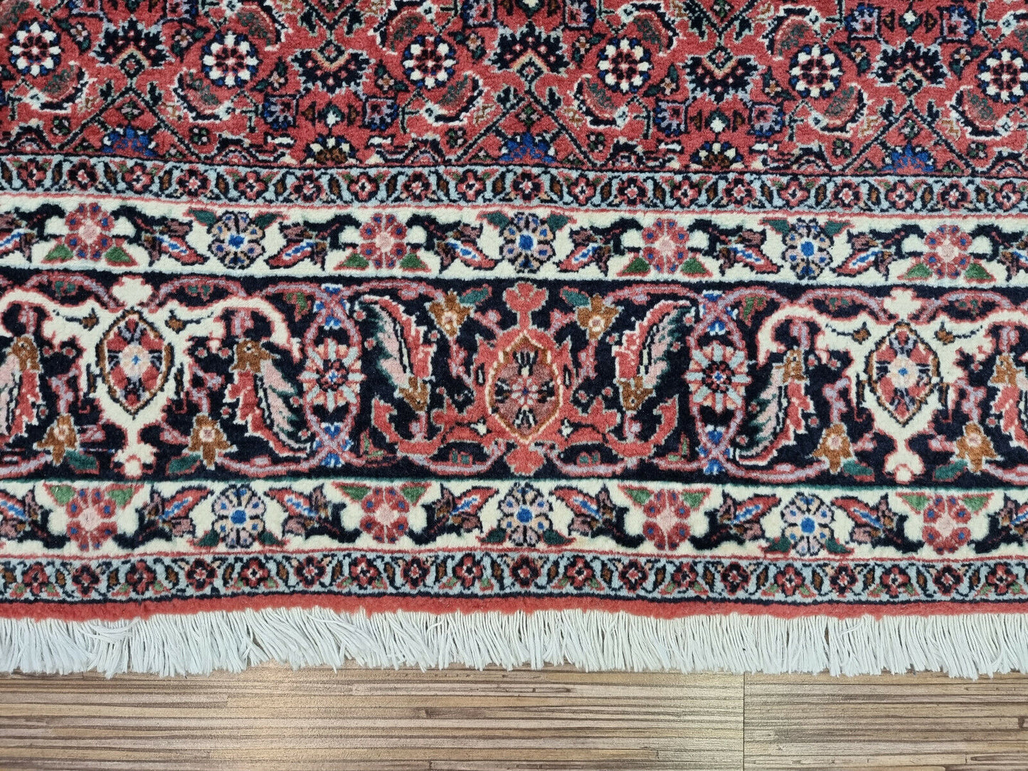Living Room Rug: A Touch of Warmth: Create a warm and inviting atmosphere in your living room with this red Persian Bidjar rug, crafted from soft and durable wool.