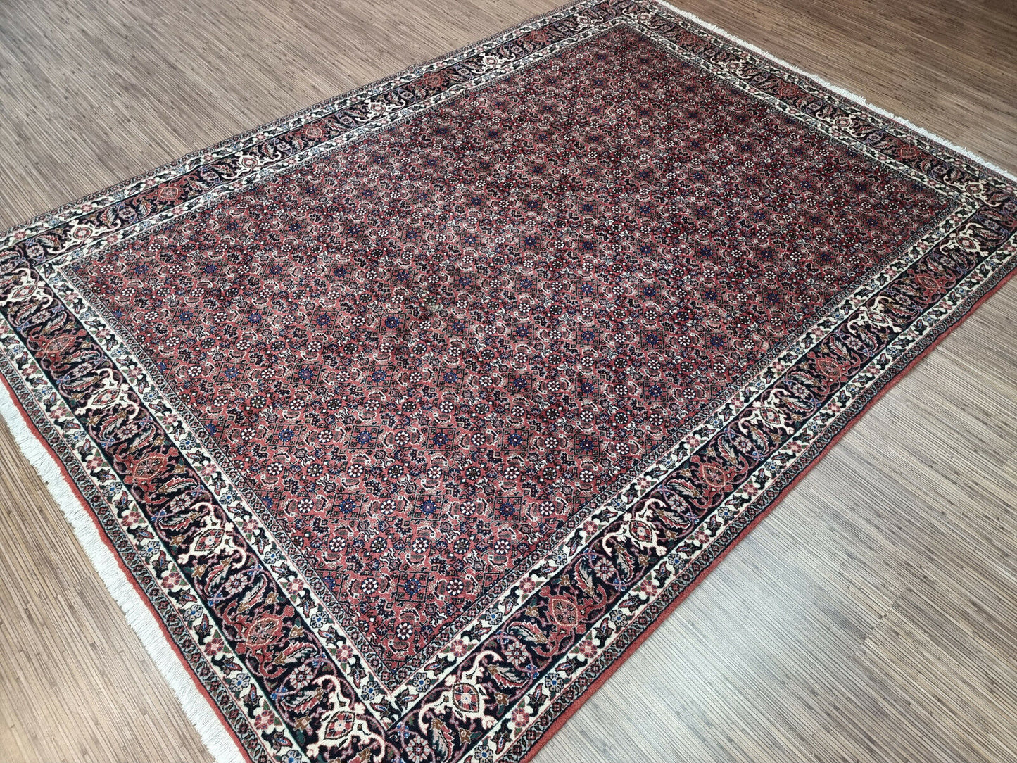 Central Medallion Rug: A Symbol of Elegance: Admire the intricate central medallion design of this vintage Persian Bidjar rug, a testament to traditional craftsmanship.