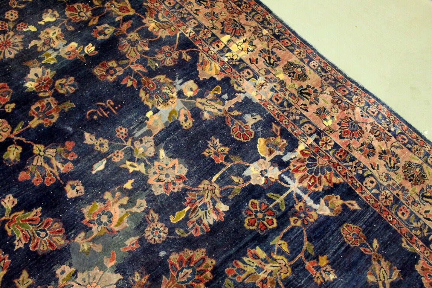 Antique Persian rug central medallion in navy and beige tones
