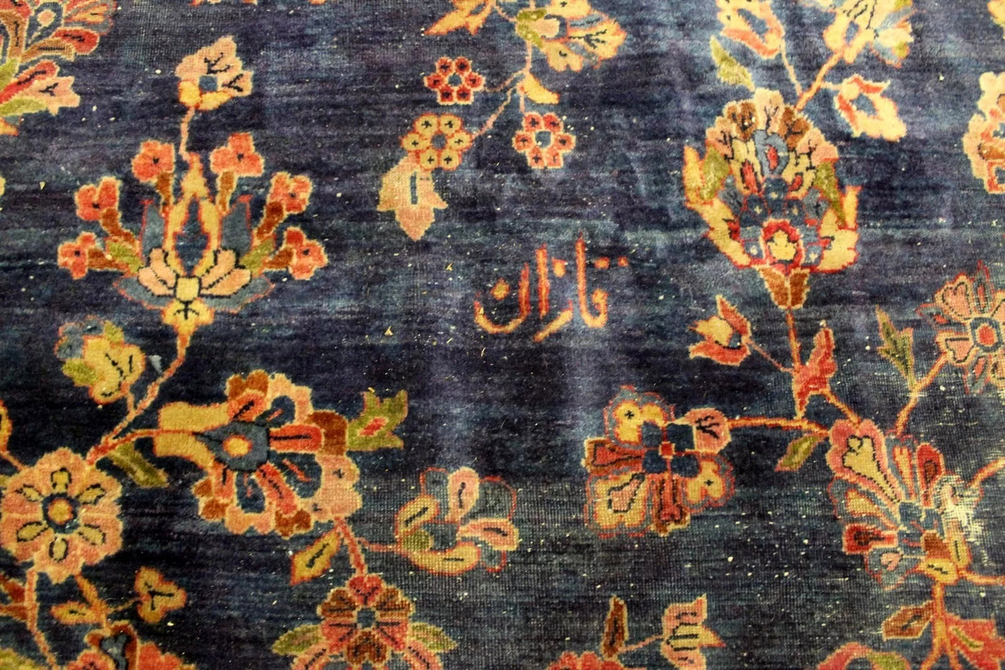 Rare Persian rug highlighting deep red and olive hues